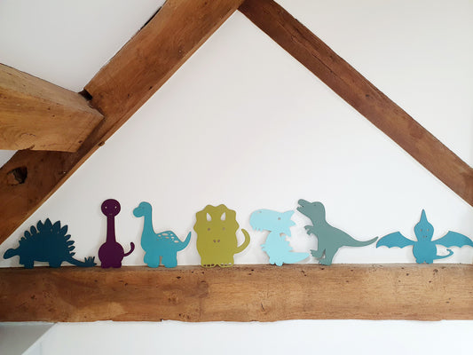 A Range of Painted Wooden Dinosaurs