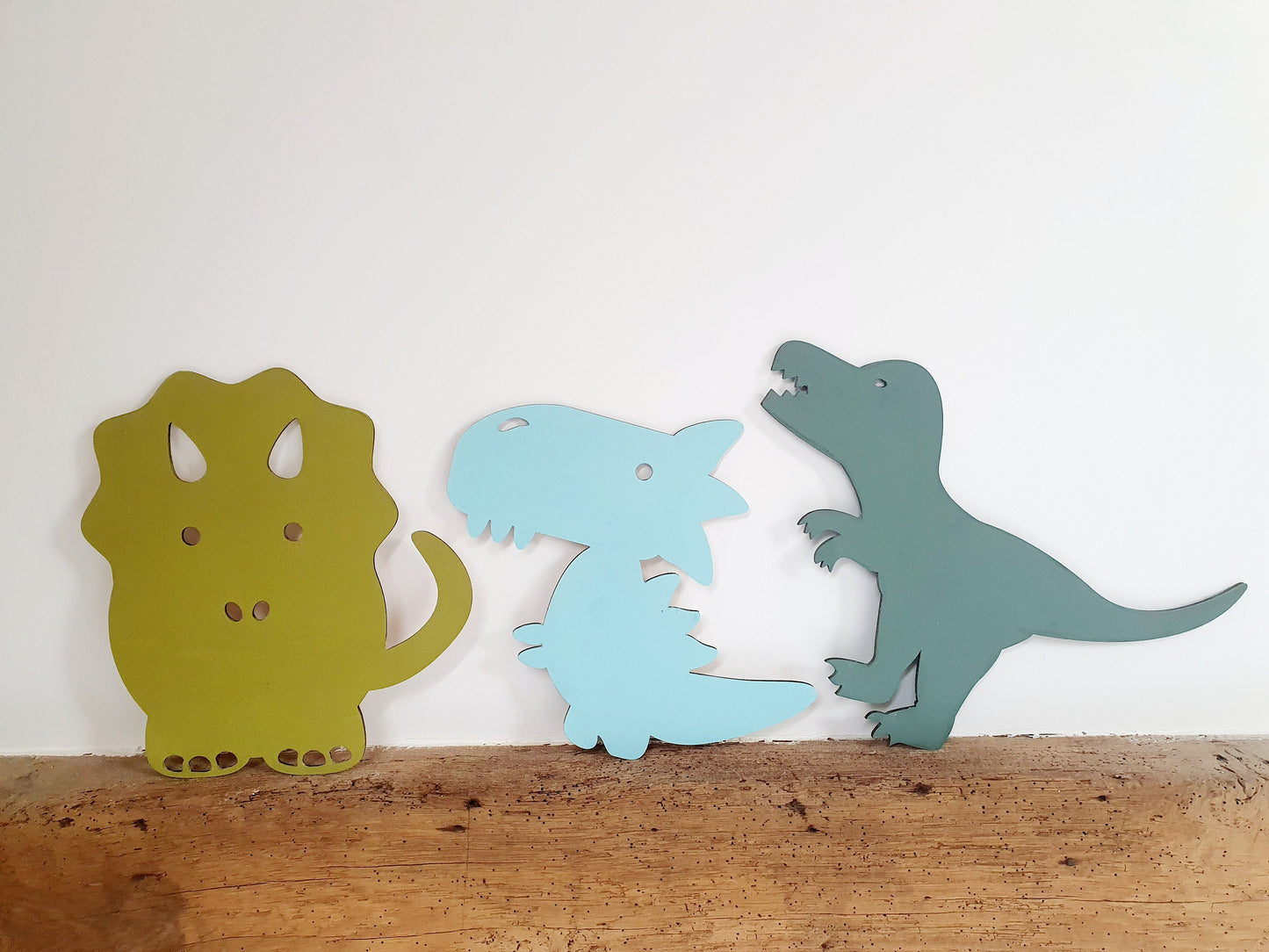 A Range of Painted Wooden Dinosaurs