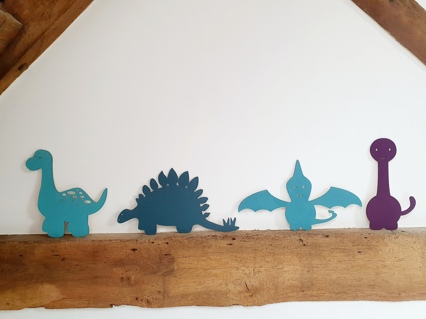 A Range of Painted Wooden Dinosaurs