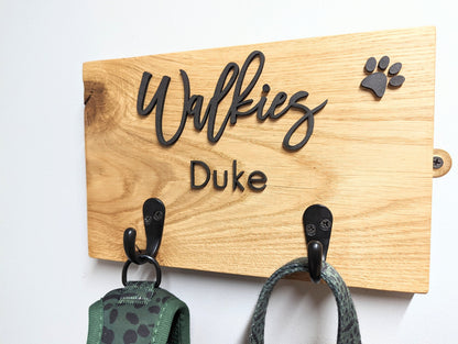 Personalised Walkies dog lead hook sign with oak base and the dog/s name with two hooks. Dog lead hook oak plaque with wording Walkies